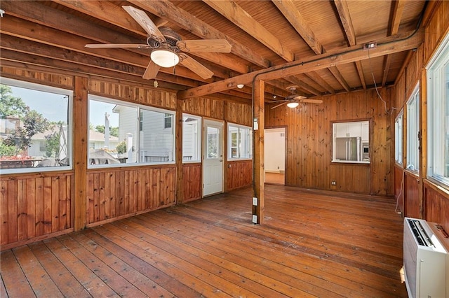 8822 Hadley St, Overland Park, KS 66212 - unfurnished sunroom with healthy amount of natural light, beamed ceiling, and a wall mounted AC