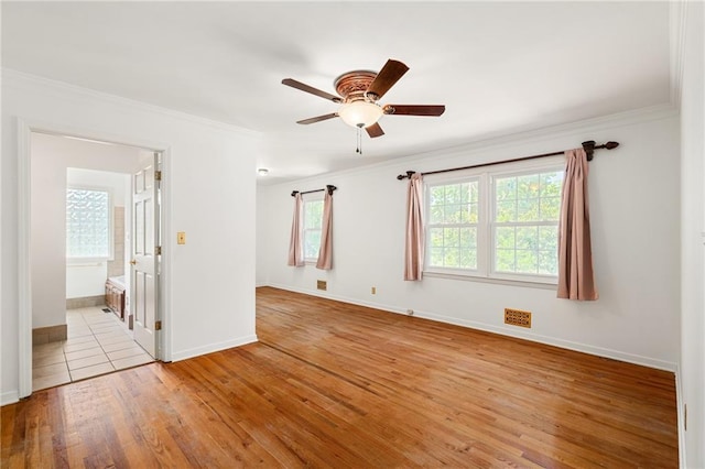 8822 Hadley St, Overland Park, KS 66212 - spare room featuring crown molding, a ceiling fan, and wood finished floors