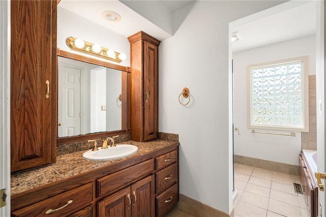 8822 Hadley St, Overland Park, KS 66212 - full bath with vanity, a tub to relax in, tile patterned flooring, and a shower