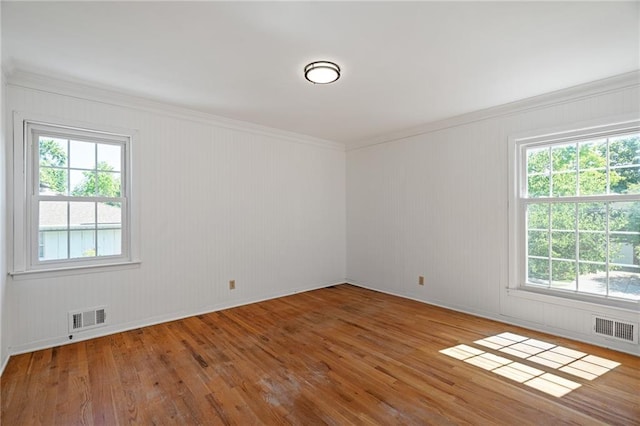 8822 Hadley St, Overland Park, KS 66212 - empty room with wood finished floors and ornamental molding