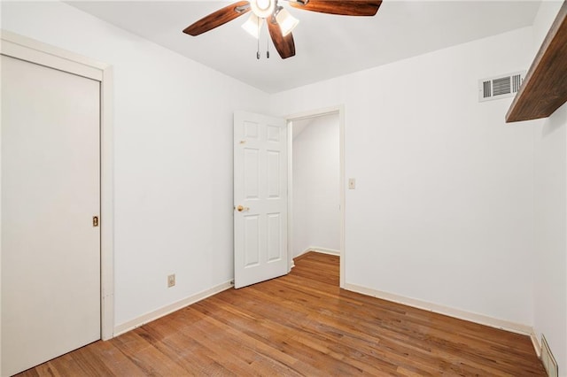 8822 Hadley St, Overland Park, KS 66212 - unfurnished bedroom with light wood-style floors and ceiling fan