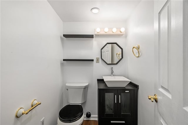 8822 Hadley St, Overland Park, KS 66212 - half bathroom with vanity and wood finished floors