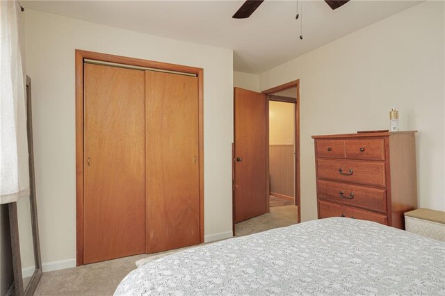 906 W Pearl St, Savannah, MO 64485 - bedroom with carpet flooring, a closet, ceiling fan, and baseboards