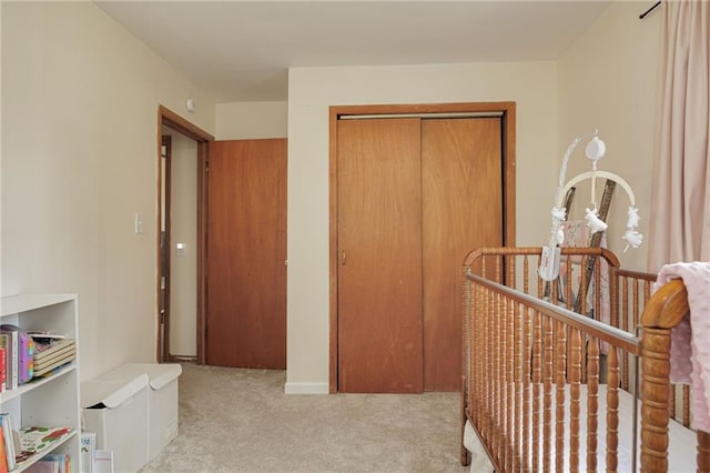 906 W Pearl St, Savannah, MO 64485 - bedroom with carpet floors, a closet, and a nursery area