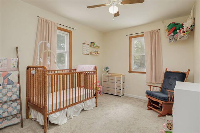 906 W Pearl St, Savannah, MO 64485 - bedroom with multiple windows, carpet, and baseboards