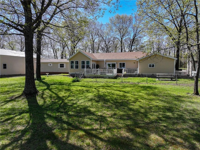 back of house featuring a deck