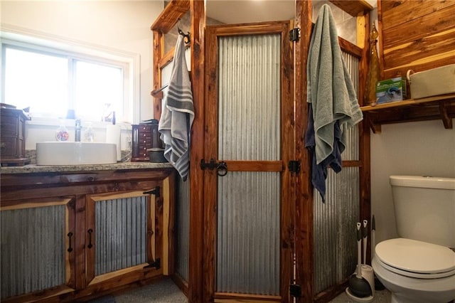 bathroom with toilet and vanity