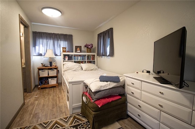 bedroom featuring wood finished floors