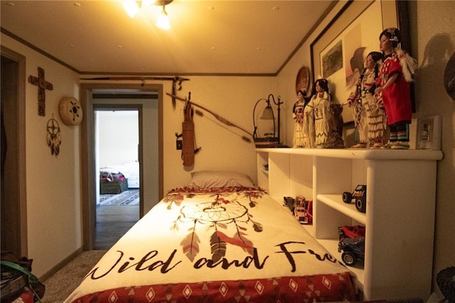 bedroom with carpet floors, crown molding, and access to outside