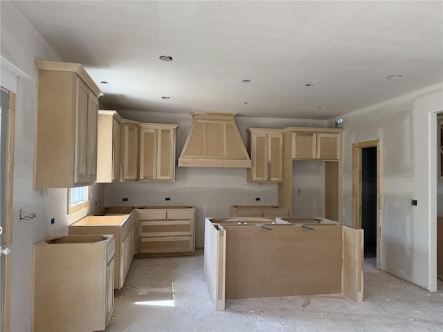 8913 N Colorado Ave, Kansas City, MO 64156 - kitchen with custom range hood, a kitchen island, and light brown cabinets