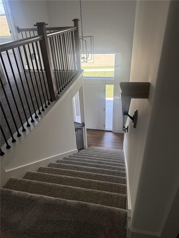 8913 N Colorado Ave, Kansas City, MO 64156 - stairs featuring carpet and wood finished floors