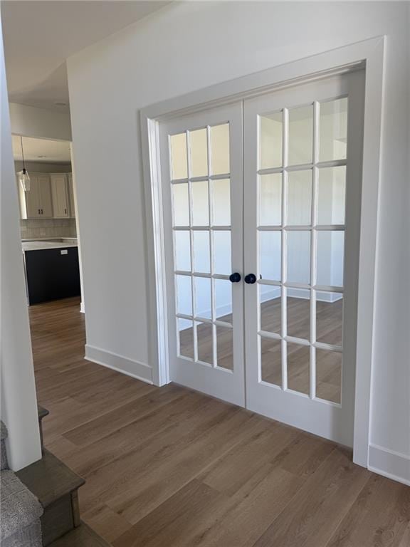 8913 N Colorado Ave, Kansas City, MO 64156 - doorway with wood finished floors and french doors