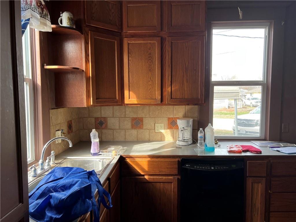 206 W 4th St, Norborne, MO 64668 - kitchen with dishwasher, a sink, light countertops, tasteful backsplash, and open shelves