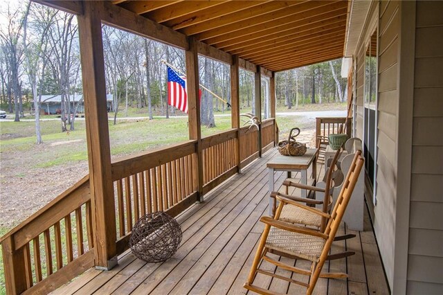 10200 SE 1075th Rd, Collins, MO 64738 - wooden deck featuring a porch and a yard