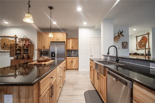 10200 SE 1075th Rd, Collins, MO 64738 - kitchen with stainless steel appliances, a sink, recessed lighting, dark stone countertops, and hanging light fixtures