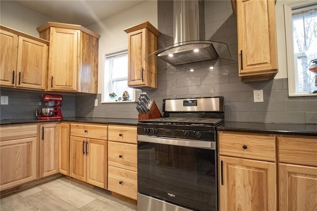 10200 SE 1075th Rd, Collins, MO 64738 - kitchen featuring range hood, stainless steel gas range oven, light brown cabinets, and backsplash