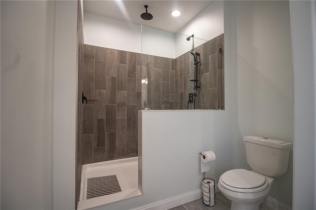 10200 SE 1075th Rd, Collins, MO 64738 - bathroom featuring toilet, walk in shower, and baseboards