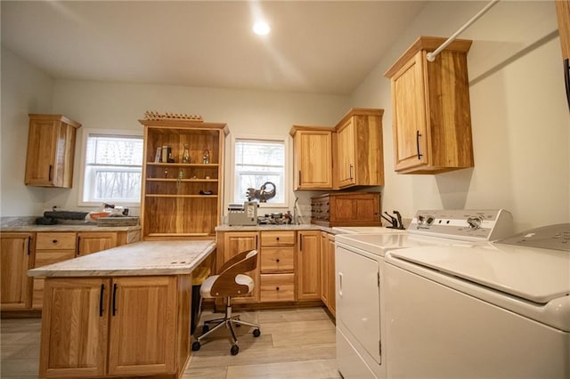 10200 SE 1075th Rd, Collins, MO 64738 - clothes washing area with washing machine and clothes dryer, cabinet space, an office area, and light wood-style floors