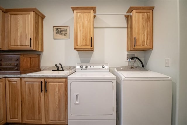 10200 SE 1075th Rd, Collins, MO 64738 - laundry area featuring washing machine and clothes dryer and cabinet space
