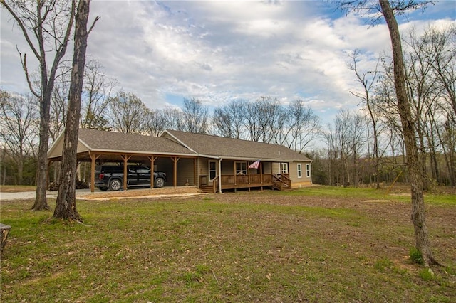 10200 SE 1075th Rd, Collins, MO 64738 - back of house featuring a lawn, covered porch, an attached carport, a shingled roof, and driveway