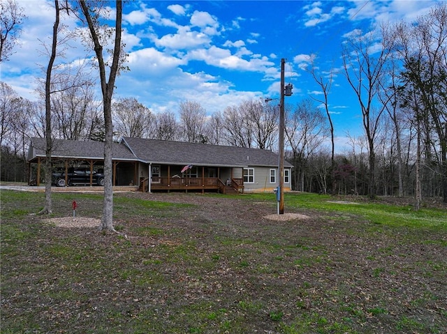 10200 SE 1075th Rd, Collins, MO 64738 - single story home with a porch, a carport, driveway, and a shingled roof
