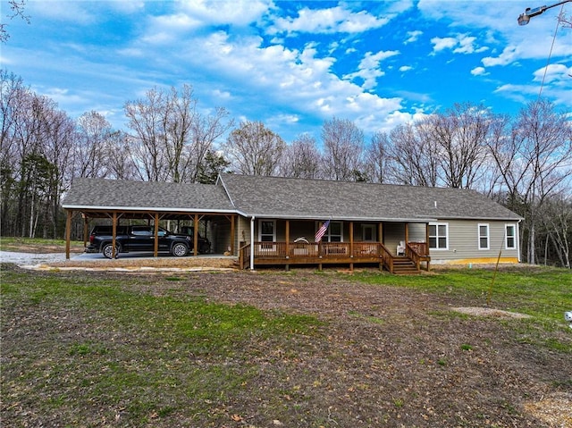 10200 SE 1075th Rd, Collins, MO 64738 - view of front of house featuring a porch, an attached carport, roof with shingles, and driveway