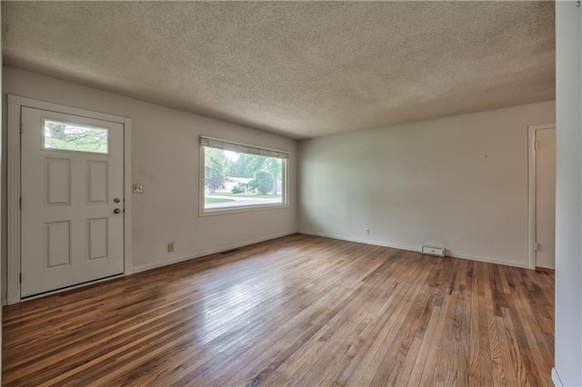 4306 W 78th Ter, Prairie Village, KS 66208 - entryway with hardwood / wood-style flooring, a textured ceiling, and baseboards