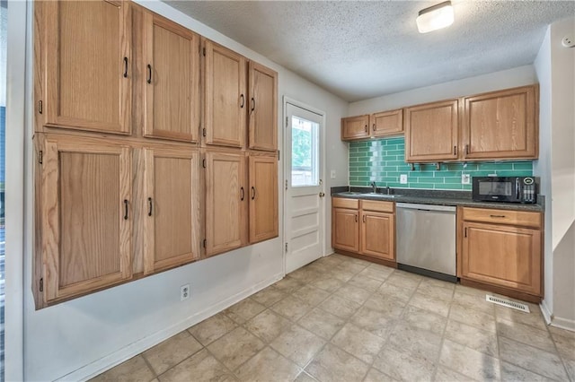 4306 W 78th Ter, Prairie Village, KS 66208 - kitchen with dishwasher, black microwave, a textured ceiling, a sink, and dark countertops