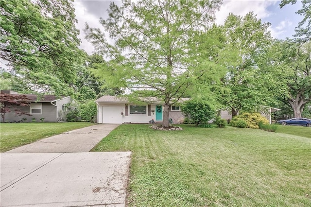 4306 W 78th Ter, Prairie Village, KS 66208 - view of front of house featuring concrete driveway, a front yard, and an attached garage