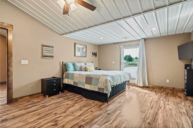 bedroom with wood finished floors, baseboards, access to exterior, and ceiling fan