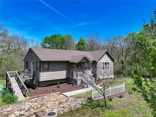 10875 SE 54th Hwy, Collins, MO 64738 - ranch-style house with stairs, fence, roof with shingles, and covered porch