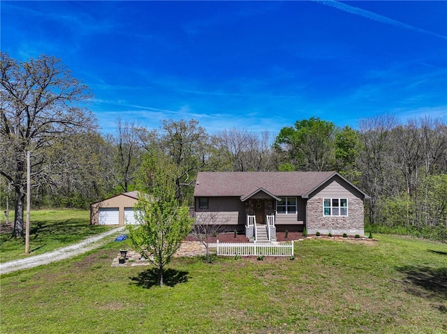 10875 SE 54th Hwy, Collins, MO 64738 - ranch-style house featuring an outdoor structure, a garage, a porch, a front yard, and dirt driveway