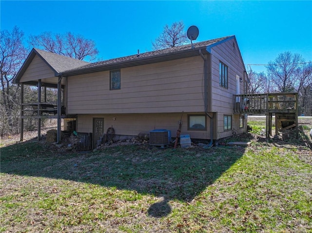 10875 SE 54th Hwy, Collins, MO 64738 - view of property exterior featuring central AC, a yard, and a deck