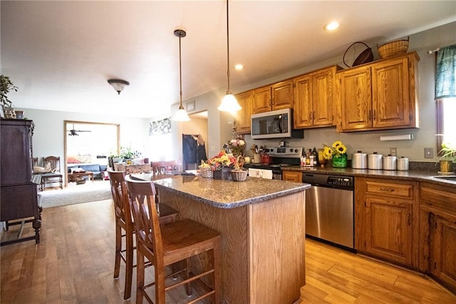 10875 SE 54th Hwy, Collins, MO 64738 - kitchen with appliances with stainless steel finishes, plenty of natural light, dark countertops, and recessed lighting