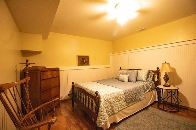 10875 SE 54th Hwy, Collins, MO 64738 - bedroom featuring a wainscoted wall and wood finished floors