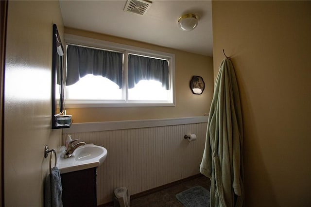 10875 SE 54th Hwy, Collins, MO 64738 - bathroom featuring vanity and a wainscoted wall