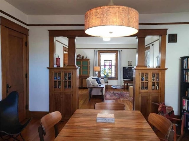 dining area with wood finished floors