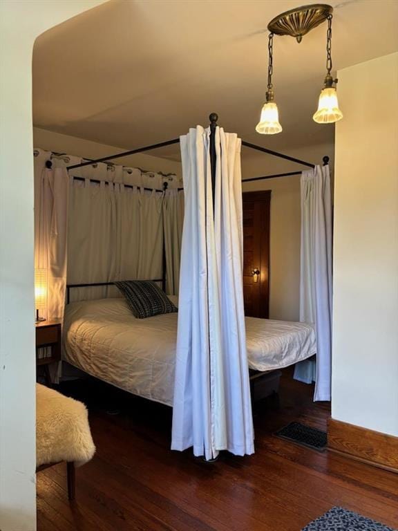 bedroom with hardwood / wood-style flooring