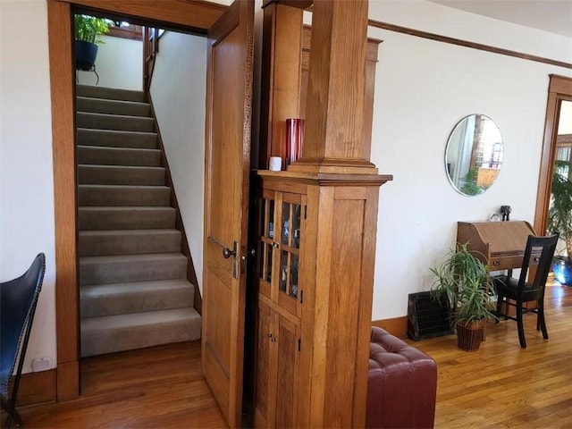 staircase featuring wood finished floors