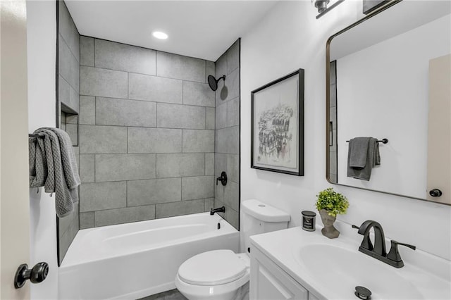 bathroom featuring toilet,  shower combination, and vanity