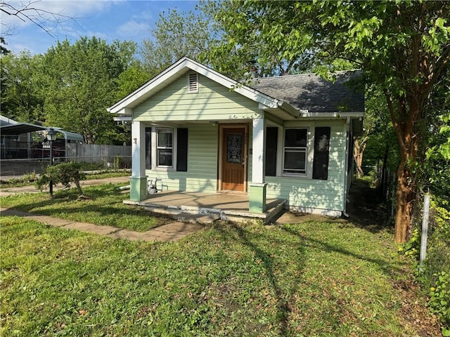 2544 S Overton Ave, Independence, MO 64052 - bungalow featuring a porch and a shingled roof