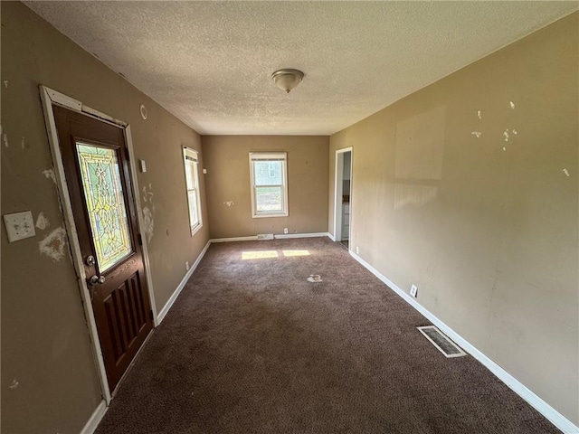 2544 S Overton Ave, Independence, MO 64052 - carpeted spare room with a textured ceiling and baseboards