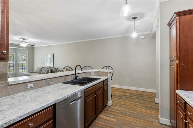 14037 W 112th Ter, Olathe, KS 66062 - kitchen with dishwasher, a sink, dark wood-style floors, ornamental molding, and baseboards