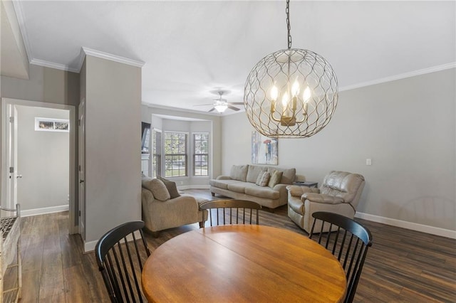 14037 W 112th Ter, Olathe, KS 66062 - dining area featuring baseboards, wood finished floors, a ceiling fan, crown molding, and a chandelier