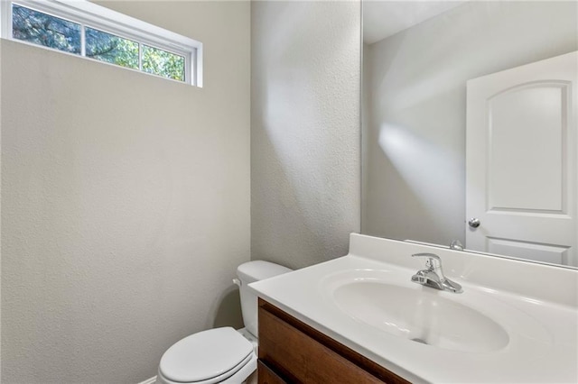 14037 W 112th Ter, Olathe, KS 66062 - half bath featuring vanity, toilet, and a textured wall