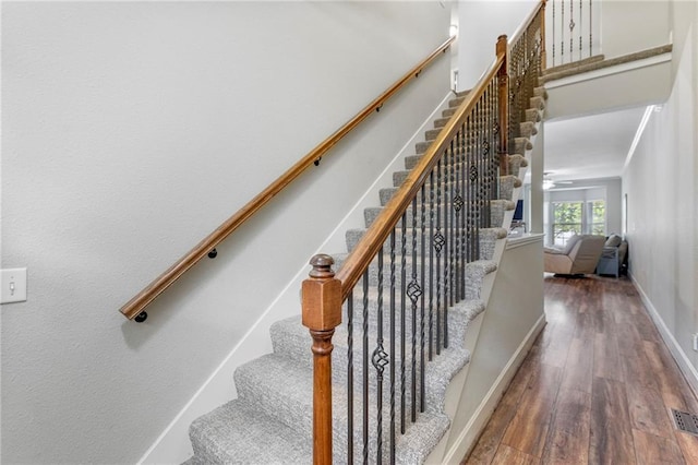 14037 W 112th Ter, Olathe, KS 66062 - stairway featuring wood finished floors and baseboards