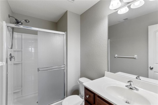 14037 W 112th Ter, Olathe, KS 66062 - full bathroom with a shower stall, toilet, a textured wall, vanity, and a textured ceiling