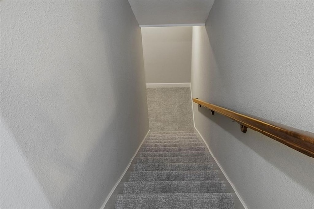 14037 W 112th Ter, Olathe, KS 66062 - stairway with carpet, a textured wall, and baseboards