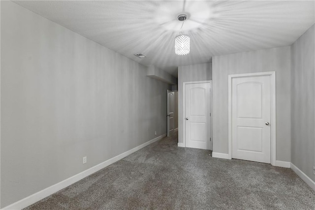 14037 W 112th Ter, Olathe, KS 66062 - unfurnished bedroom featuring carpet floors, baseboards, and a chandelier