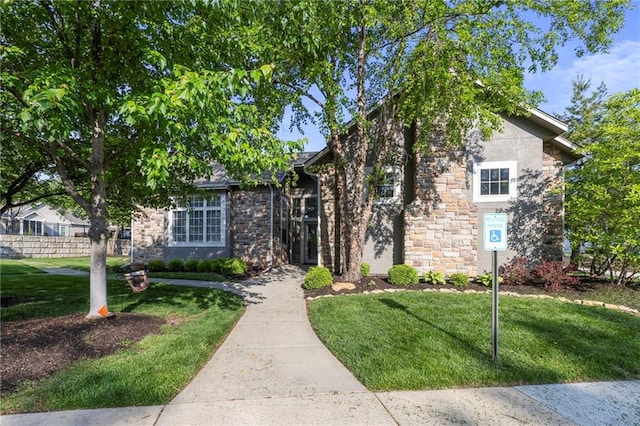 14037 W 112th Ter, Olathe, KS 66062 - obstructed view of property featuring a front lawn and stone siding